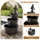 Three-tier outdoor barrel waterfall fountain with vintage bronze finish and decorative pump for a relaxing garden retreat.