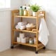 3-tier bamboo utility cart with wheels, featuring toiletries and towels, ideal for bathroom or kitchen organization.