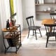Industrial sideboard with wine rack and Windsor chairs, featuring rustic finishes for stylish dining and storage.