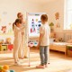 Kids using the 3-in-1 double-sided wooden art easel with paper roll, showcasing creativity in a bright playroom.
