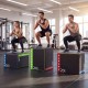 Three athletes using a 3-in-1 plyometric box with height options of 16, 20, and 24 inches for effective training.