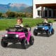 Two kids driving battery-powered electric trucks in pink and blue, featuring LED headlights and safety seat belts.