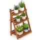 Foldable 3-tier solid wood plant stand with potted plants, ideal for patio or balcony use, featuring a stable.