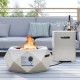 Geometric terrazzo fire pit table set with stainless steel burner, 40,000 BTU, paired with a side table for outdoor use.