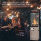 41,000 BTU propane patio heater with metal hood, providing powerful heat and ambient flames for outdoor gatherings.