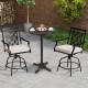 Round cast aluminum patio bar table with intricate patterns, suitable for outdoor settings like gardens and backyards.