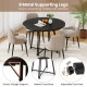 Round black dining table with 8 metal legs, cross base, and wood-like texture, seating 4-6 people comfortably.