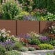 Brown outdoor privacy fence screen with spacious panels, ideal for concealing AC units and enhancing backyard privacy.