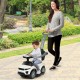 Toddler riding in a white 3-in-1 push car stroller with music, designed for children aged 12-36 months.