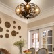 Enclosed ceiling fan with light in matte black, featuring a retro cage design, ideal for small spaces like hallways.