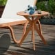 27-inch round solid wood bistro table with X-shaped legs, varnished for waterproofing, ideal for outdoor or indoor use.