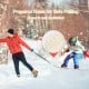 Snowboard with adjustable foot straps and pulling holes, made of sturdy wood, ideal for kids' winter sports fun.