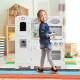 Kids playing with a white kitchen pretend play cookware set featuring a water dispenser, promoting hand-eye.