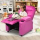 Kids recliner chair in pink with cup holders and footrest, designed for comfort and relaxation in living rooms.