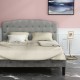 Queen upholstered headboard in light gray with button detailing, adjustable heights for versatile bedroom decor.