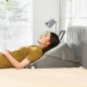 Adjustable gray memory foam wedge pillow providing back and neck support for reading or lounging in various positions.