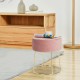 Round pink velvet footrest stool with gold metal frame, ideal for bedside use and modern home decor.