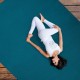 Navy workout yoga mat with double-sided anti-skid design, shown in use on a wooden floor for exercise and safety.