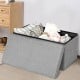 Light gray folding storage ottoman with lift top, featuring spacious interior for blankets and toys, perfect for home.