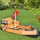Wooden pirate boat sandbox for kids with flag, rudder, and lifebuoy, featuring benches and storage for outdoor play.