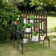 Three-tier metal plant stand in black, featuring durable steel for outdoor use, ideal for displaying potted plants on.