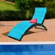 Turquoise folding patio lounge chair with cushion, made of weather-resistant PE rattan, ideal for poolside relaxation.