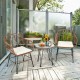 Two armchairs and a side table from a 3-piece patio rattan bistro set with white cushions, perfect for outdoor.