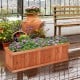 Wooden decorative planter box made of natural fir, featuring vibrant flowers, ideal for garden or patio use.