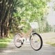 Adjustable 18-inch pink kids bike with training wheels, removable basket, and sturdy carbon steel frame for safe riding.
