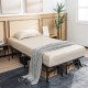 Folding steel platform bed frame in full size with beige bedding, ideal for guest use and convenient storage.