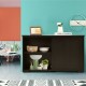 Kitchen storage cabinet with wood sliding door, featuring spacious top and two shelves, perfect for kitchen.
