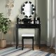 Black makeup dressing table with lighted mirror, cushioned stool, and ample storage for cosmetics in an elegant design.