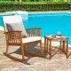 Acacia wood patio rocking chair and table set with thick cushions, perfect for outdoor relaxation by the poolside.