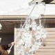Sectional snow roof rake with reinforced aluminum poles, extending from 4.8 to 20 feet, for safe snow removal.