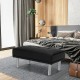 Rectangle tufted ottoman in black with stainless steel legs, perfect for living room or bedroom use.
