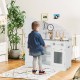 Kids kitchen playset with vivid faucet, realistic features, and storage for pretend cooking fun in a bright playroom.