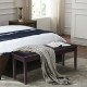 Upholstered brown PU bench with solid wood legs, ideal for dining or bedroom use, featuring a cushioned seat and.