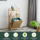 Tilt-out bamboo laundry hamper with 2-tier shelf, natural finish, and removable liner for easy storage in any room.