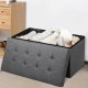 Foldable dark gray storage ottoman with removable bin, featuring a padded seat and spacious interior for blankets and.