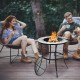 Round 23.5-inch fire pit table with mesh cover and fire poker, perfect for outdoor gatherings on the patio or backyard.