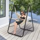 Hanging padded hammock chair with stand in beige, featuring a sturdy steel frame, ideal for indoor or outdoor.