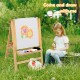Kids art easel with paper roll, double-sided chalkboard, and whiteboard for creative activities in a grassy outdoor.