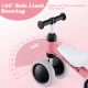 Close-up of the pink Baby Balance Bike showing 135° safe limit steering and soft anti-slip handlebars for toddlers.