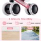Baby balance bike in pink with 4 enclosed wheels, suitable for indoor and outdoor use, promoting stability and safety.