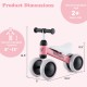 Baby balance bike in pink with four wheels, soft seat, and TPE handlebars, ideal for toddlers aged 2+ years.
