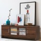Walnut media entertainment TV stand with tempered glass doors, adjustable shelves, and ample storage for living room.