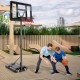 Adjustable basketball hoop system with shatterproof backboard, shown outdoors with a child and adult playing.