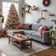 7-foot artificial Christmas tree with flocked branches, pine cones, and multicolor LED lights, perfect for festive.