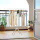 Foldable clothes drying rack with 8 bamboo rods and 40 hanger slots, ideal for drying clothes on a balcony.