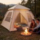 Spacious 4-person camping tent with automatic setup, rainfly, and dual doors, ideal for outdoor leisure by the campfire.